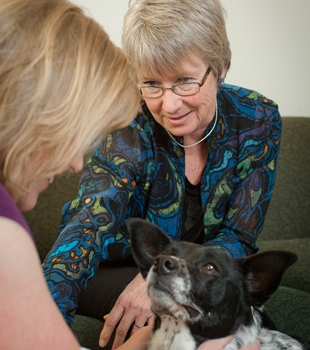 Counselor and Client With Dog