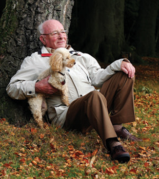 Man With Dog Under Tree