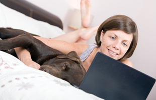 Woman and Dog at Computer