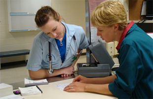 Pharmacist Consults With Student